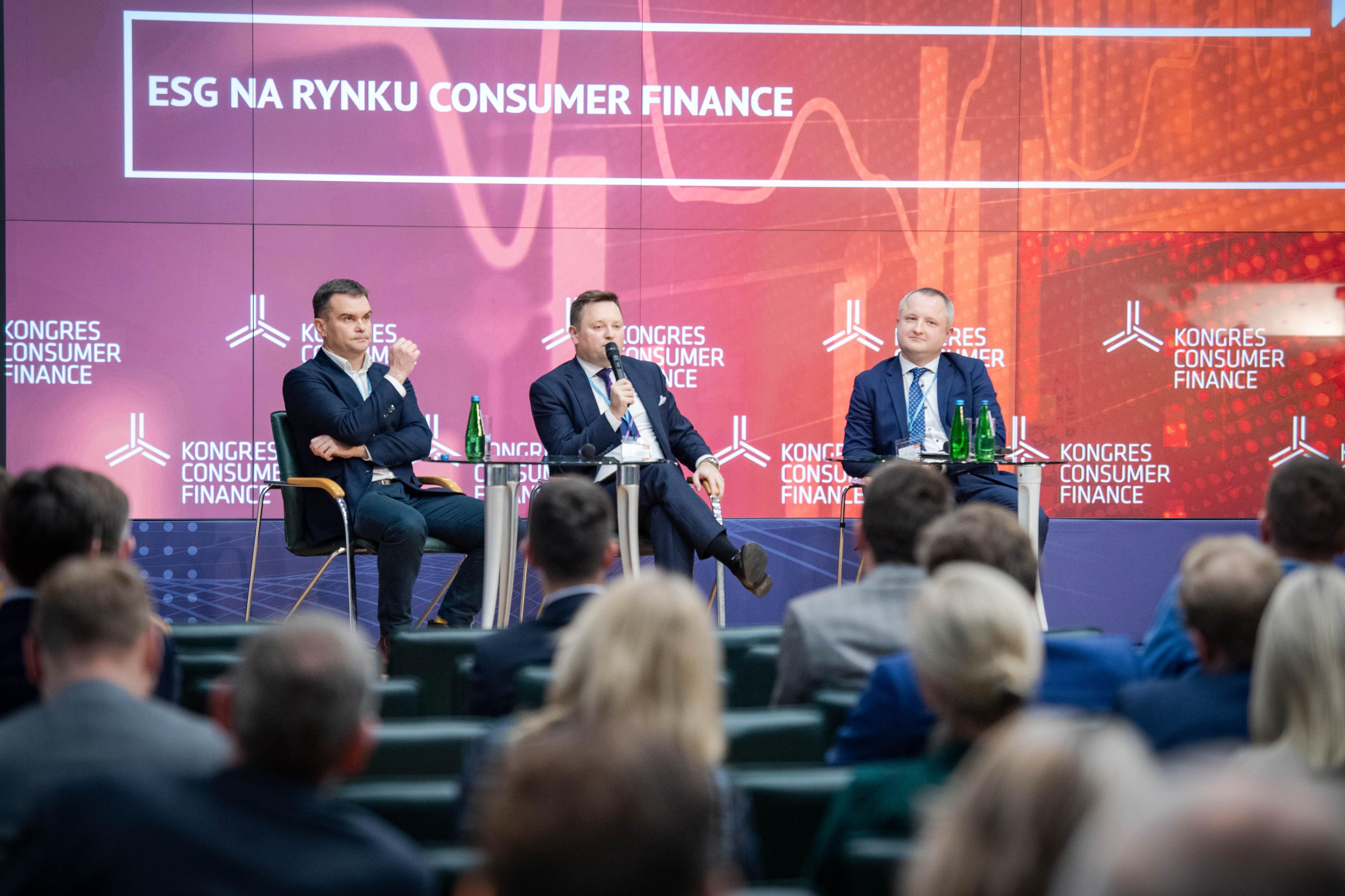Debate participants on stage and audience