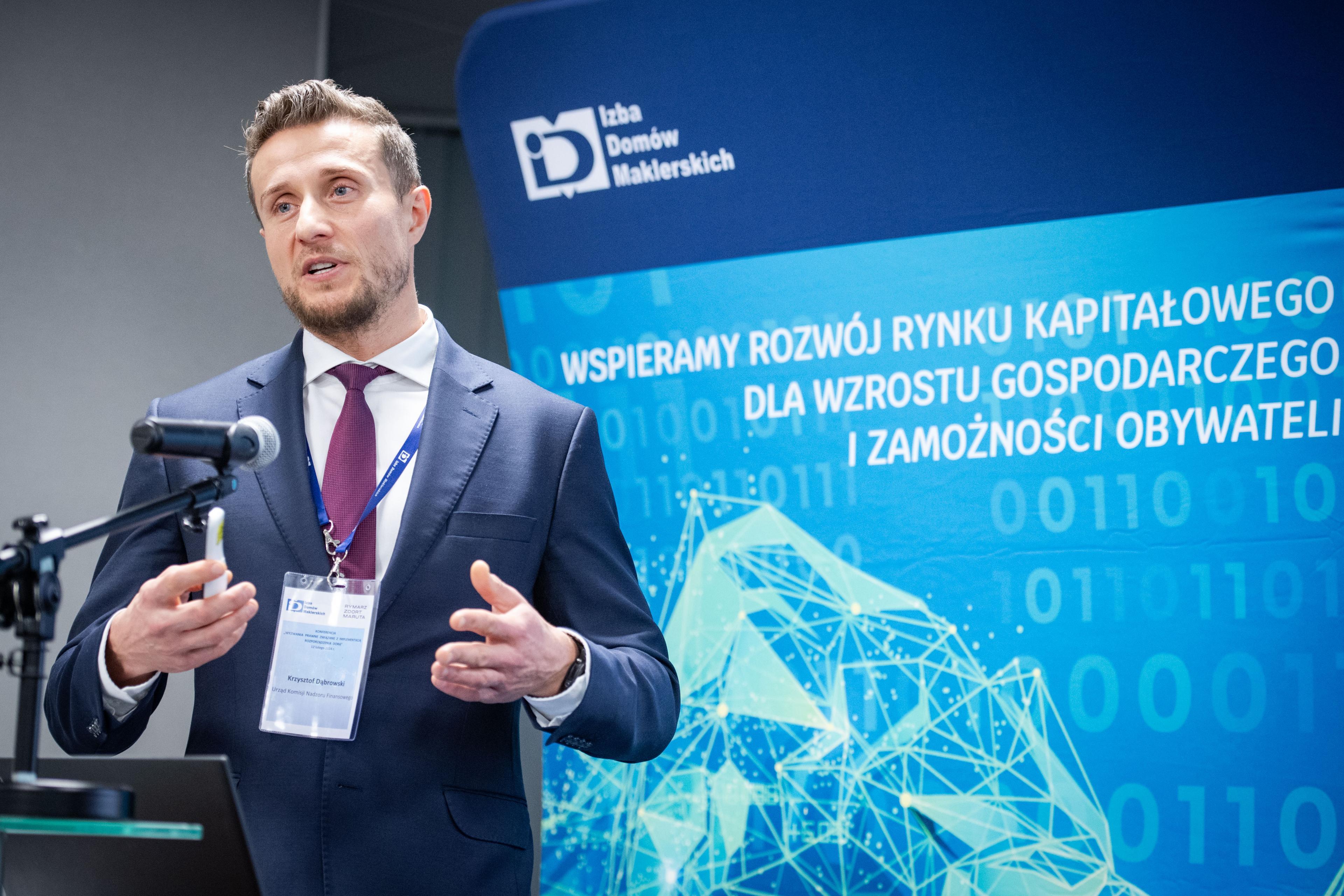 Krzysztof Dąbrowski speaks to microphone