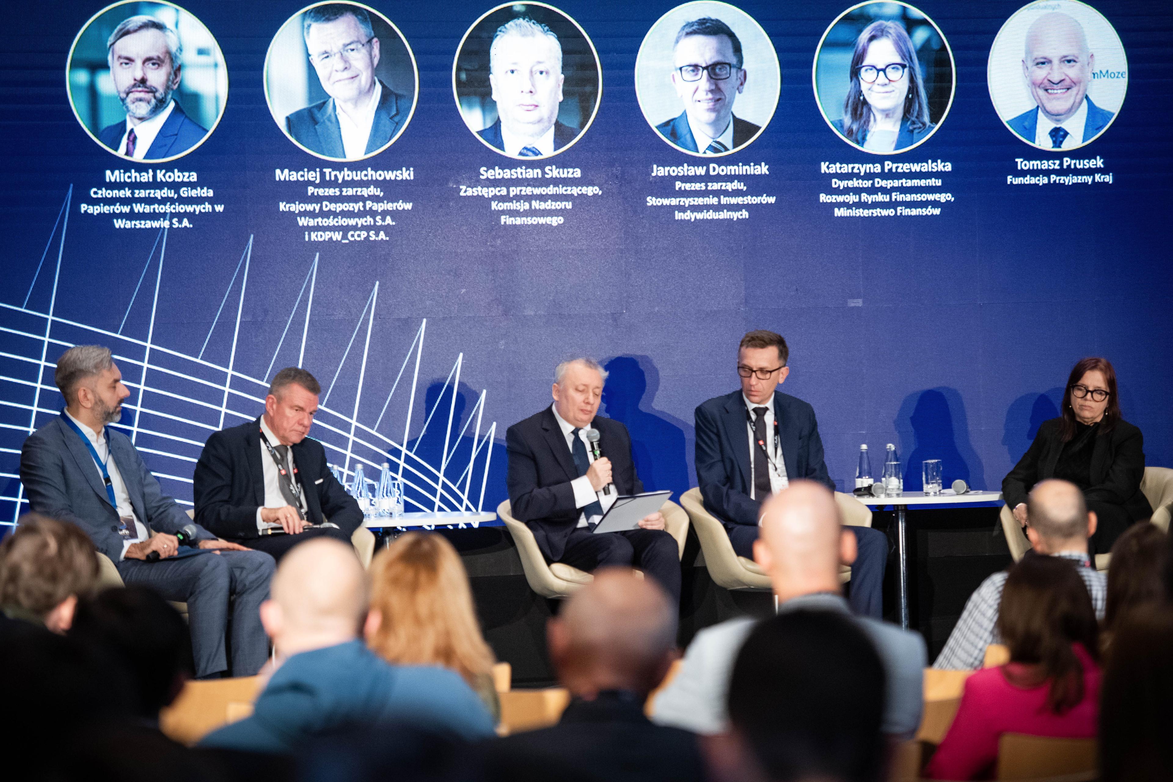 another photo of panelists on the stage